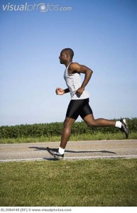 African man jogging on road